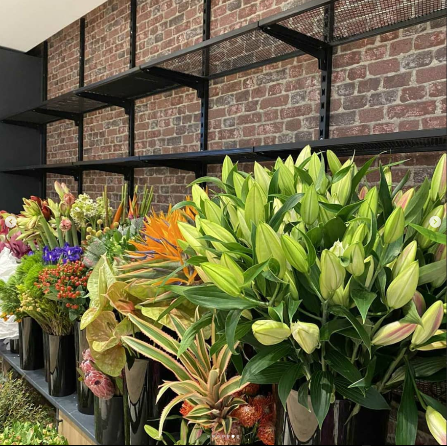 Flowers in front of a metal construction 